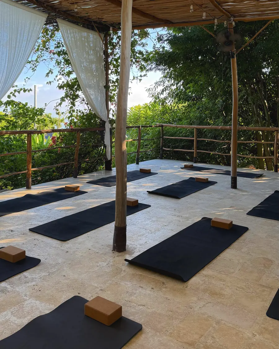Mats and blocks laid out in the covered shala