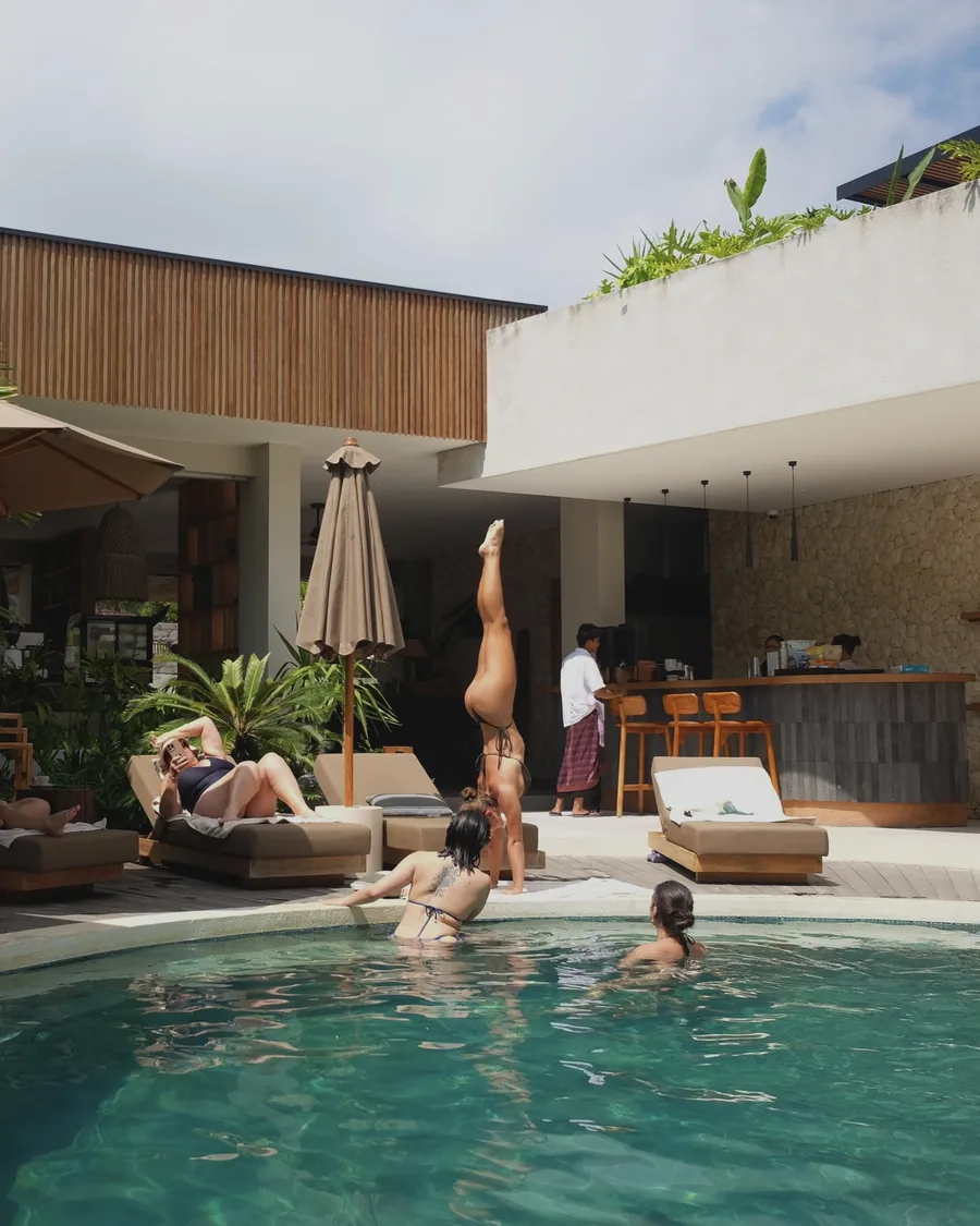 A handstand by the pool at the heart of the hotel