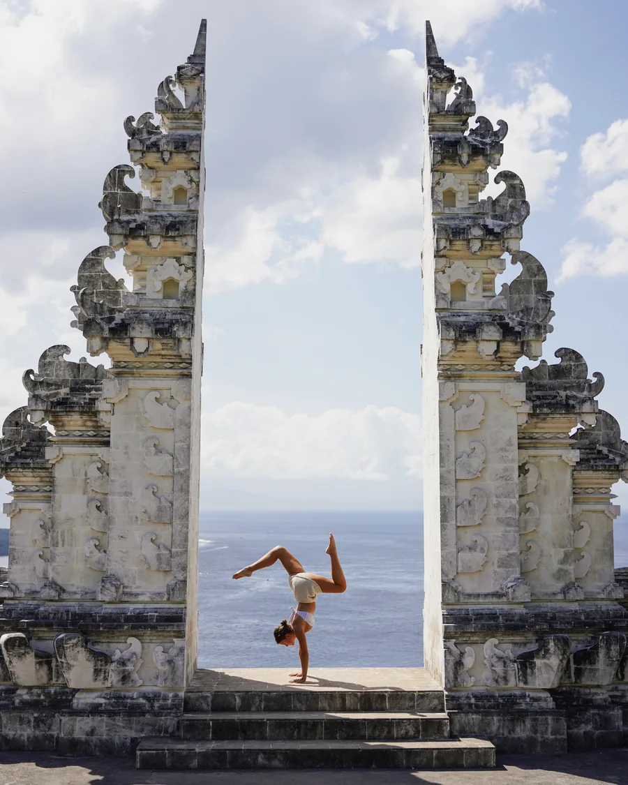The split limestone gate at the temple, opening onto the ocean