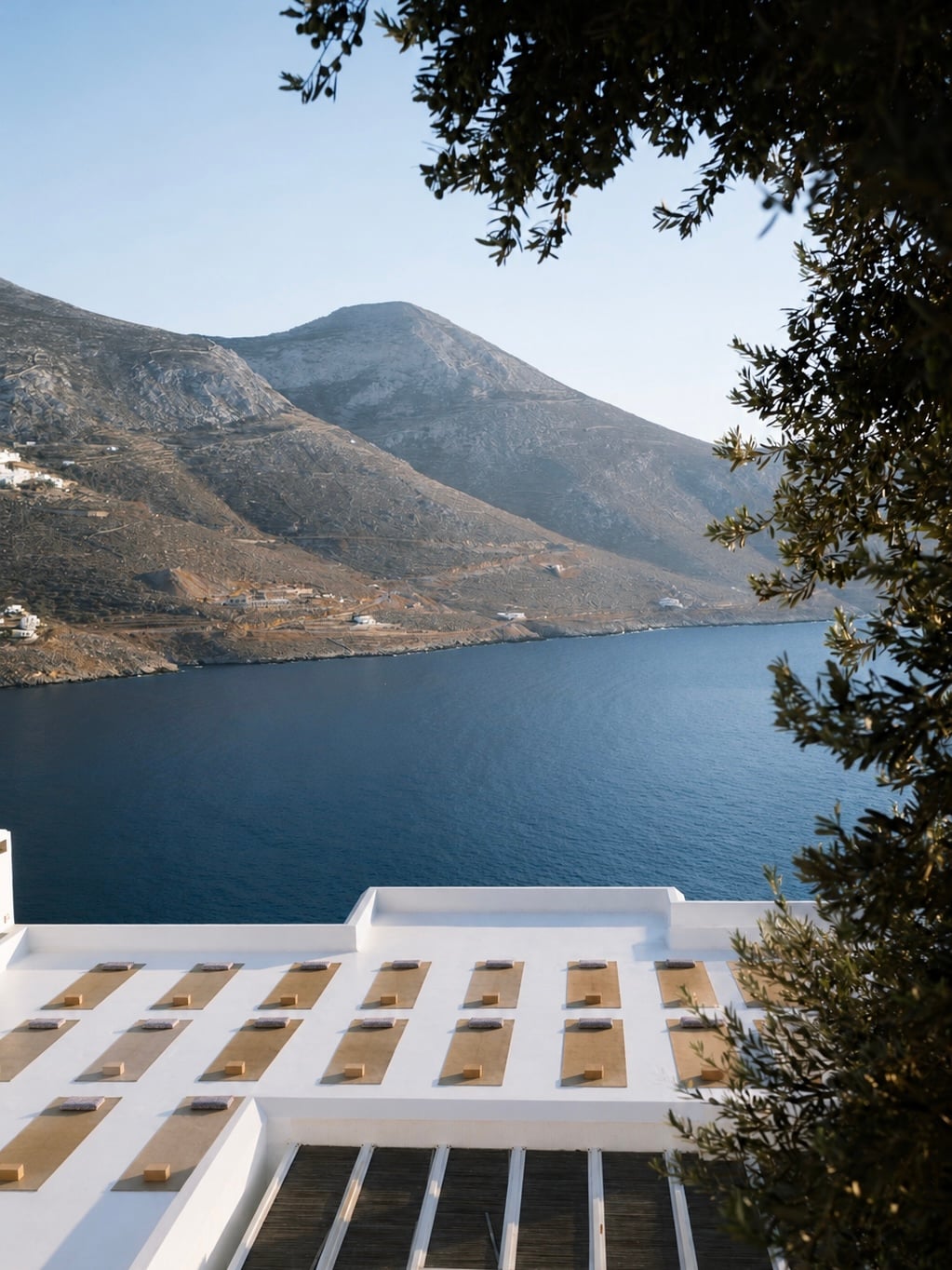 Rooftop yoga mats overlooking the Aegean on Amorgos
