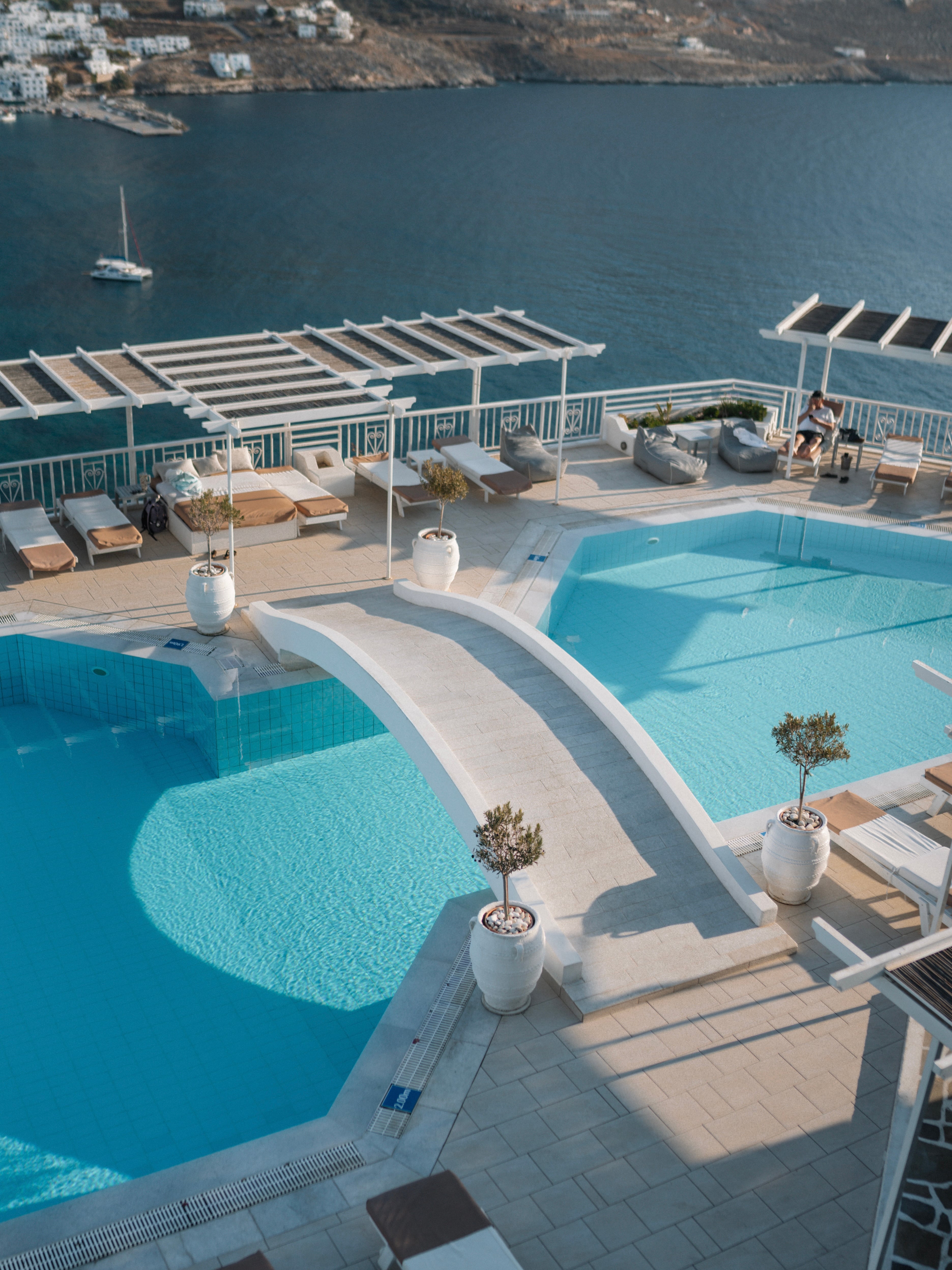 Aerial view of the resort's pools over the Aegean