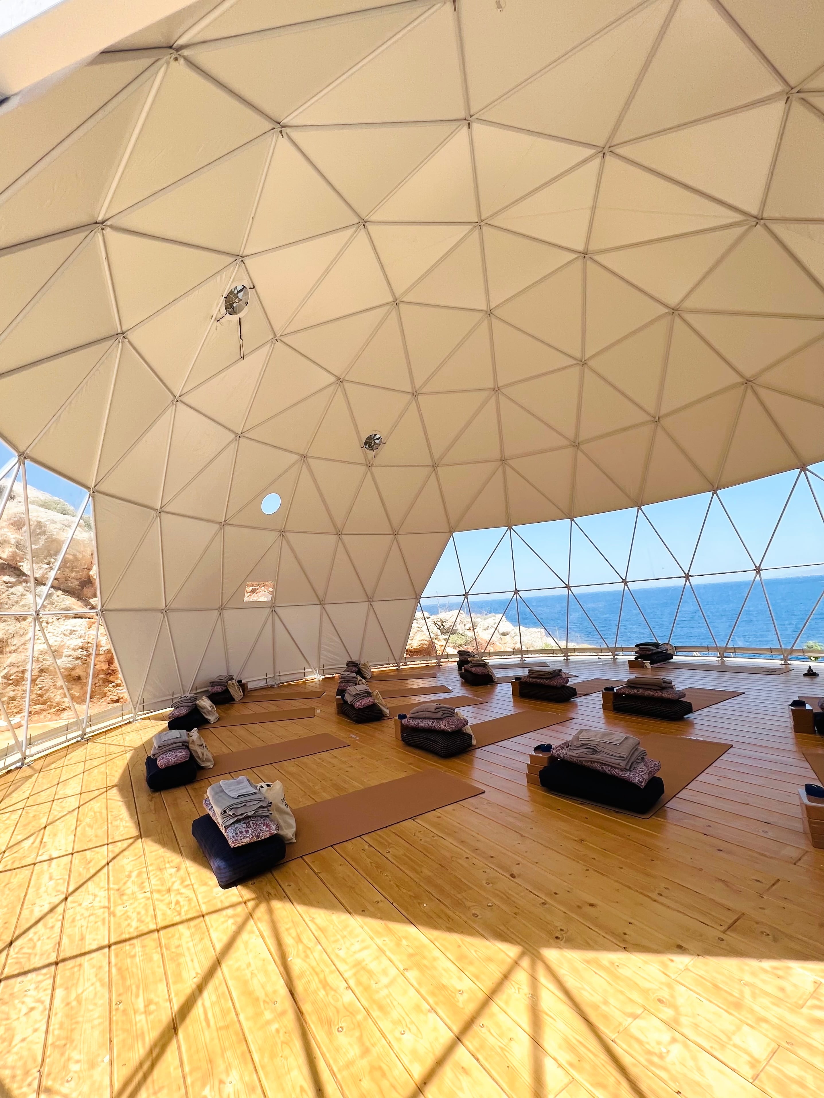 Light-filled geodesic dome shala overlooking the sea