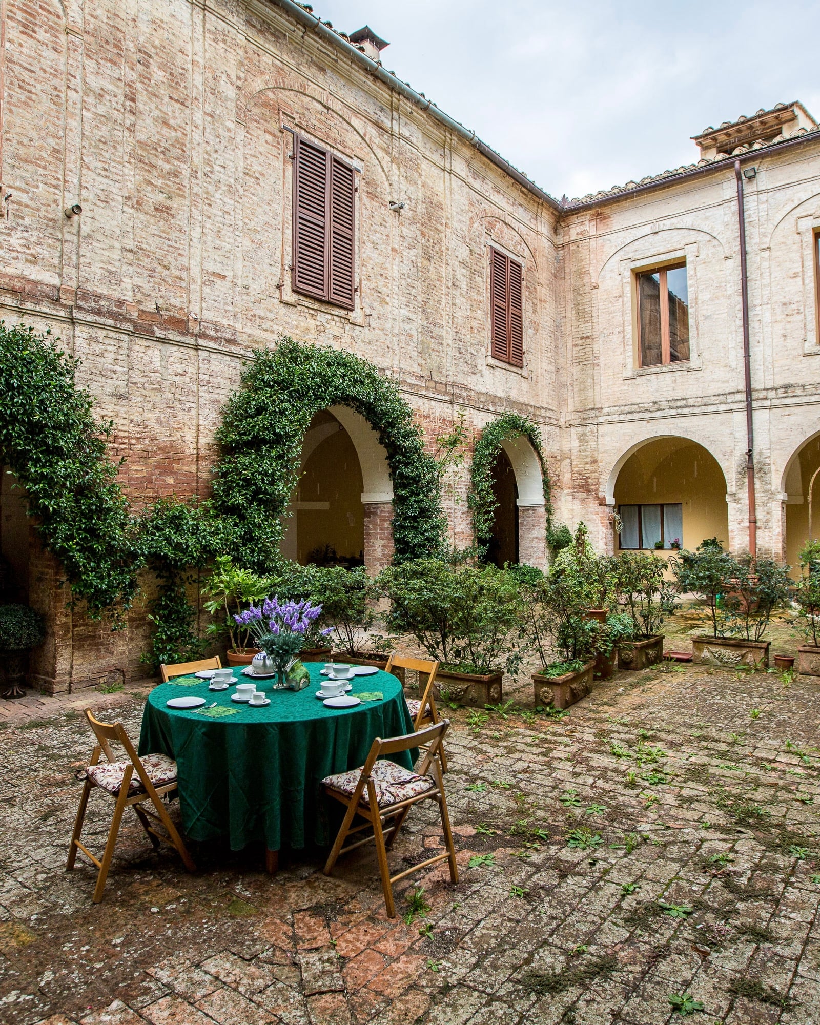 The cloister courtyard set for a long table
