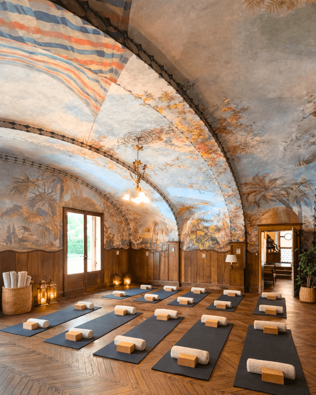 Fresco-covered shala set up for yoga practice